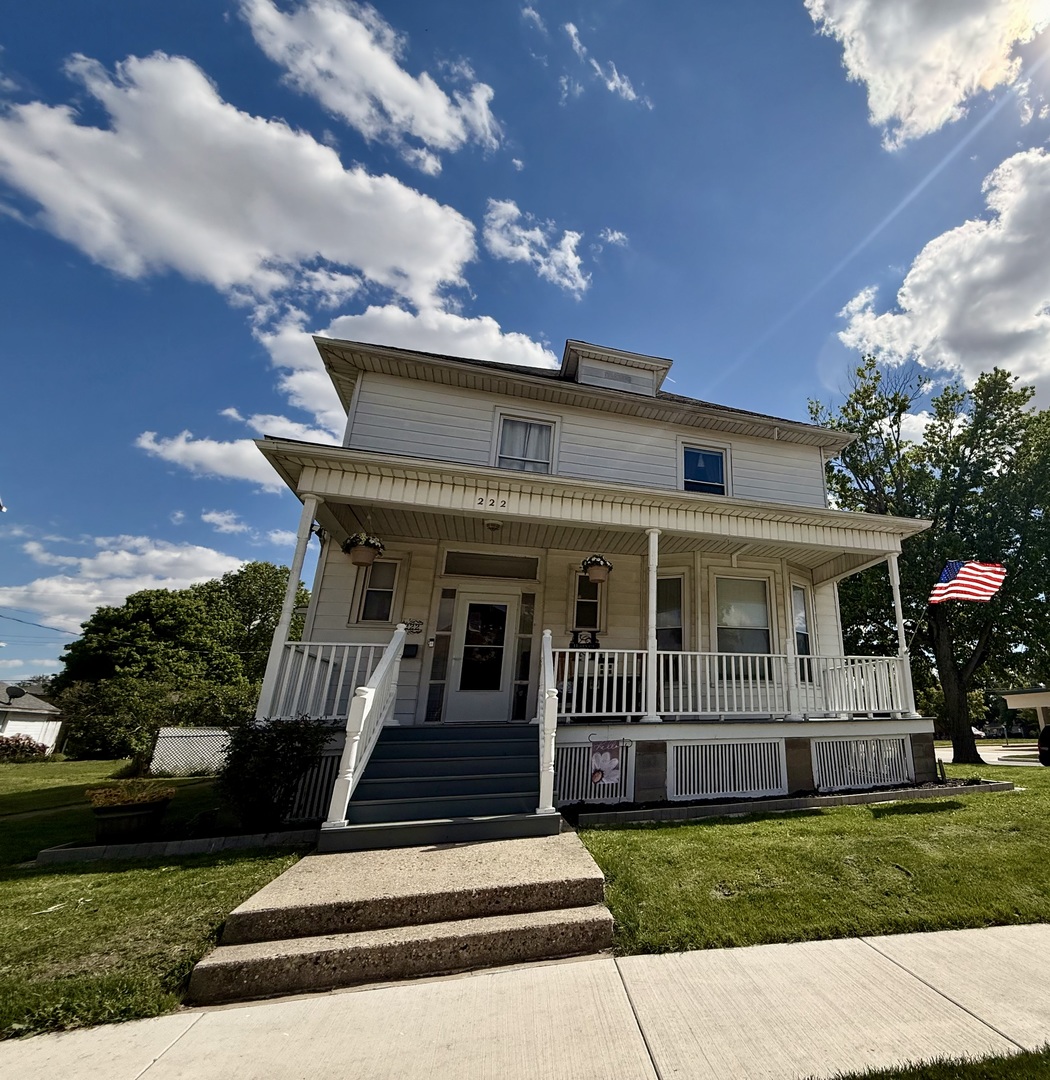 222 West Main Street Clinton, IL 61727 - Photo 25 of 25 a front view of a house with a yard