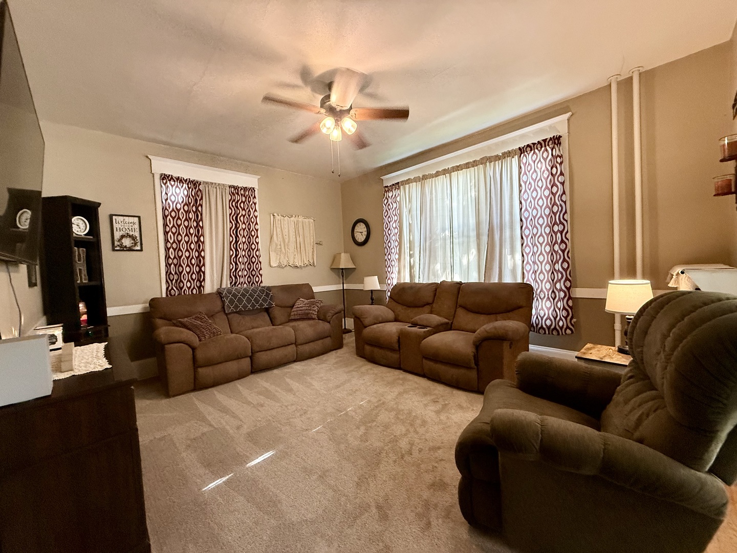 222 West Main Street Clinton, IL 61727 - Photo 8 of 25 a living room with furniture and a large window
