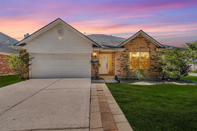 a front view of a house with yard