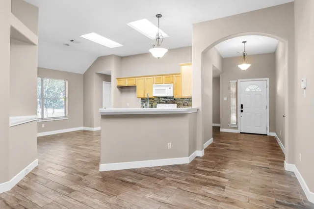 a view of a kitchen with a sink and cabinet
