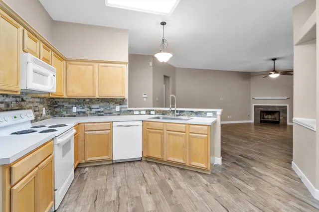 a kitchen with a white cabinets stove and sink