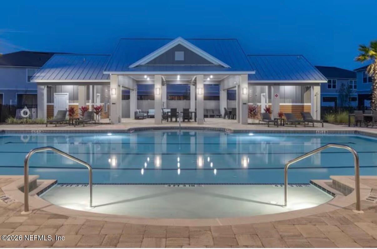 a patio with a table and chairs