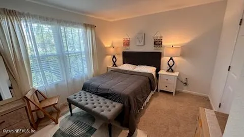 a bedroom with a bed and a table in it