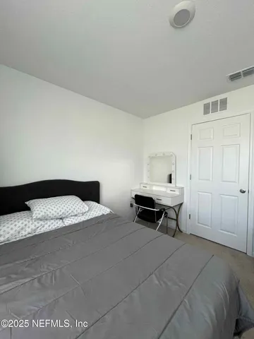 a bathroom with a sink toilet and mirror