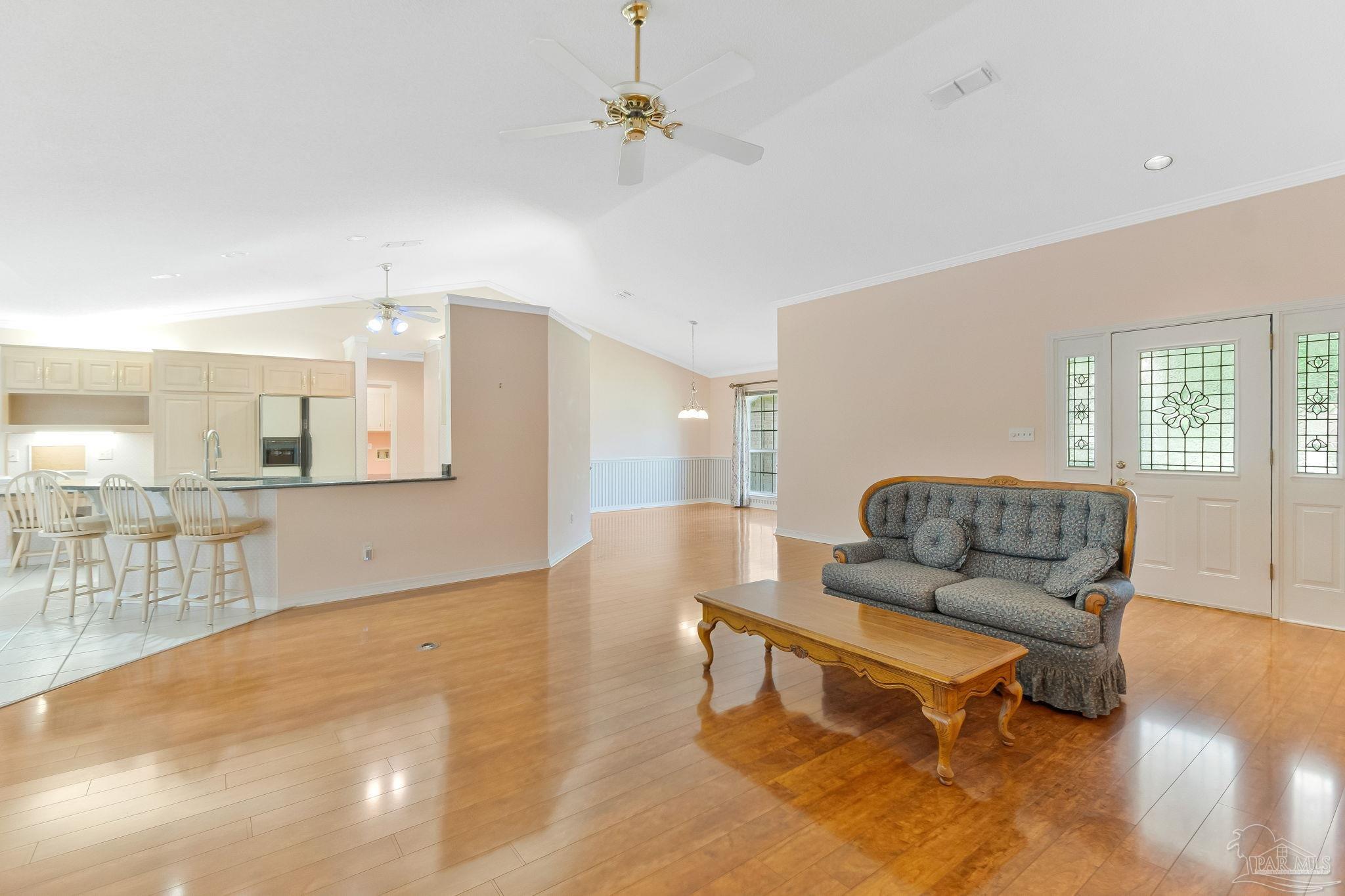 9320 Bell Ridge Drive Pensacola, FL 32526 - Photo 17 of 55 a living room with furniture and a wooden floor
