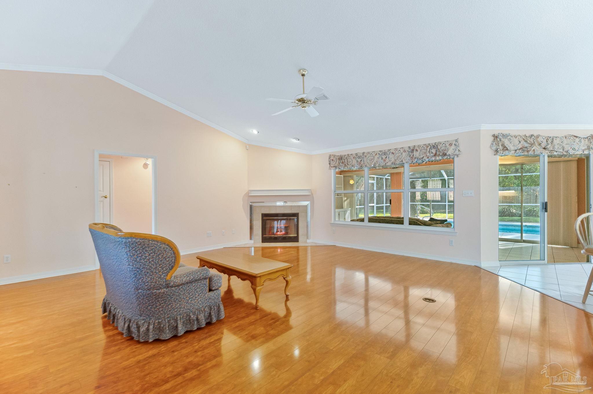 9320 Bell Ridge Drive Pensacola, FL 32526 - Photo 18 of 55 a living room with furniture and a fireplace