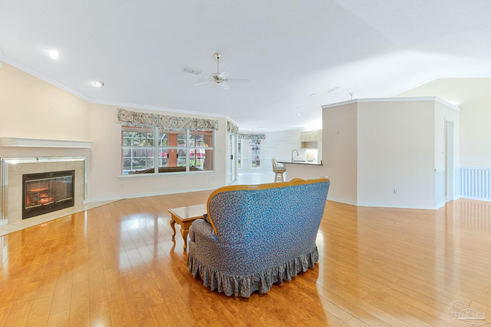 9320 Bell Ridge Drive Pensacola, FL 32526 - Photo 19 of 55 a living room with furniture and a fireplace