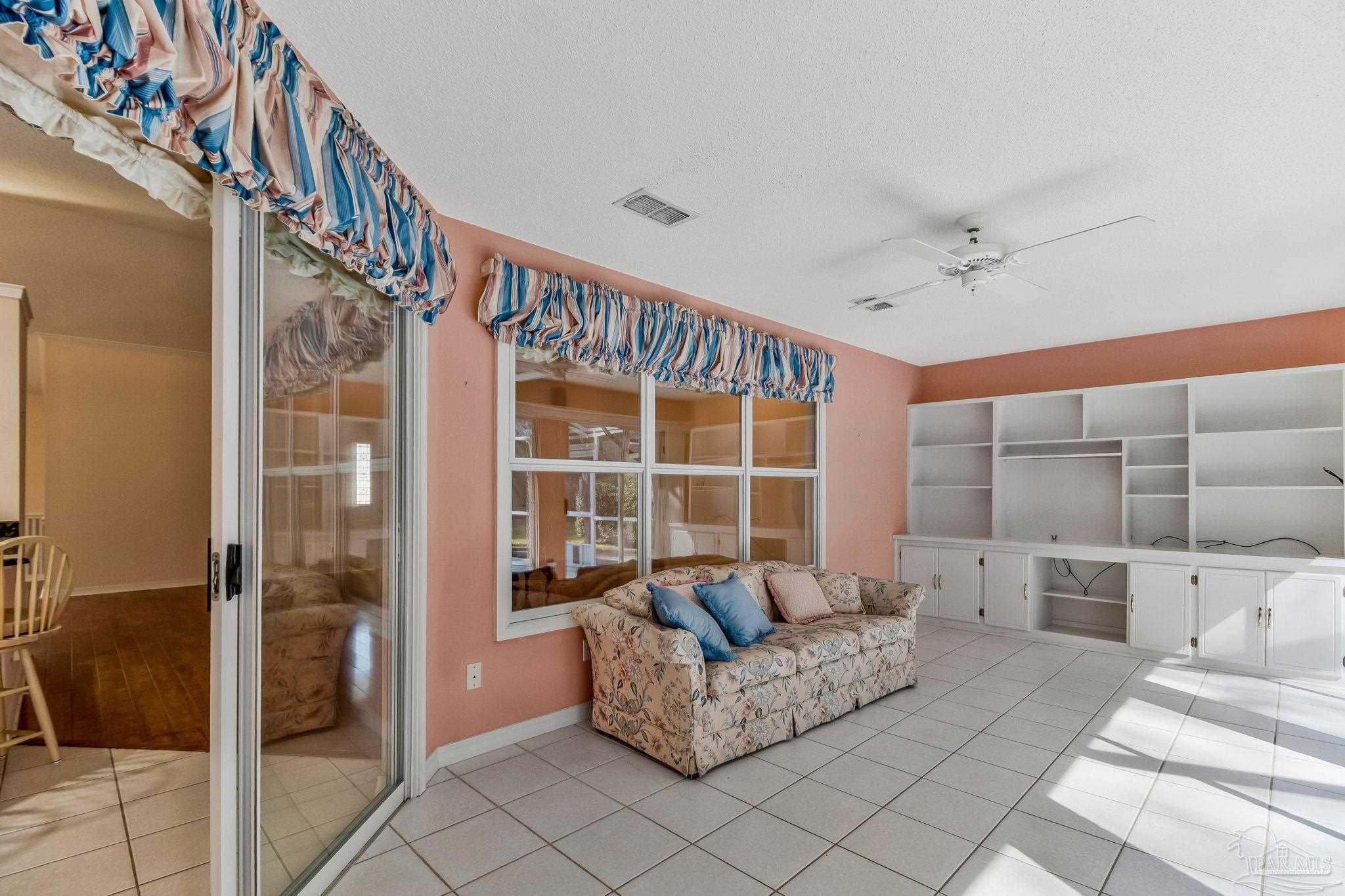 9320 Bell Ridge Drive Pensacola, FL 32526 - Photo 20 of 55 a living room with furniture and a potted plant