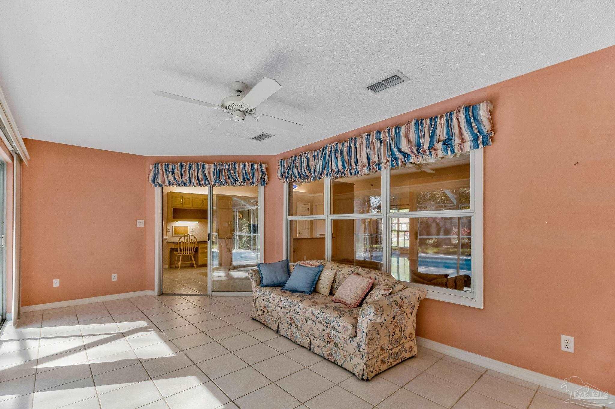 9320 Bell Ridge Drive Pensacola, FL 32526 - Photo 21 of 55 a living room with furniture and a large window