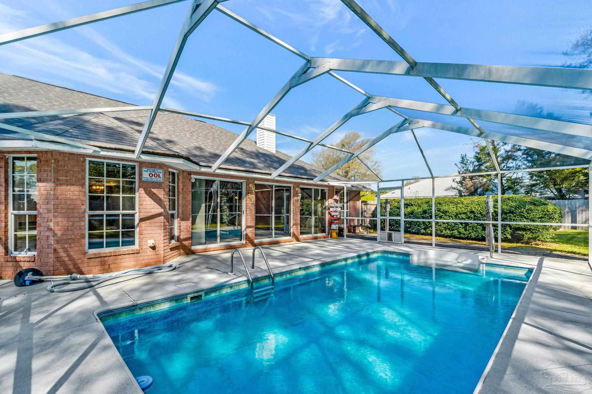 9320 Bell Ridge Drive Pensacola, FL 32526 - Photo 24 of 55 a view of a swimming pool with a patio