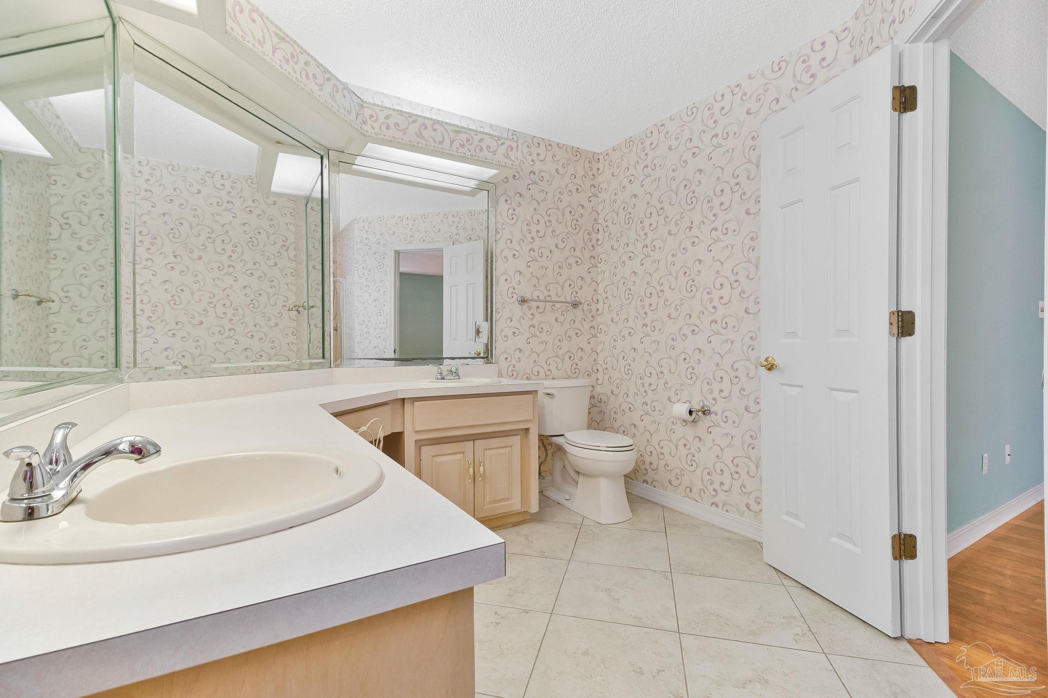 9320 Bell Ridge Drive Pensacola, FL 32526 - Photo 42 of 55 a bathroom with a sink and a mirror