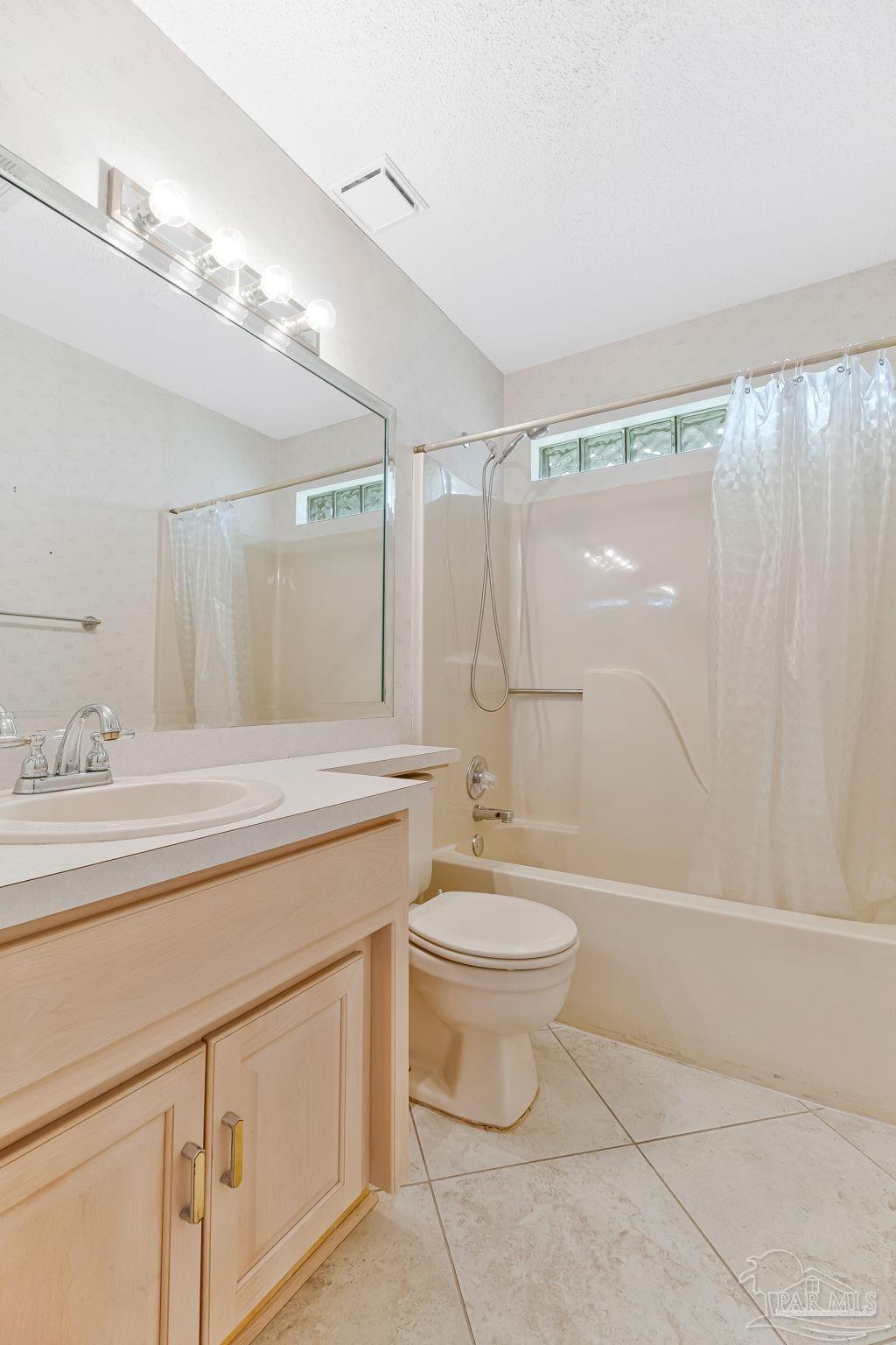 9320 Bell Ridge Drive Pensacola, FL 32526 - Photo 47 of 55 a bathroom with a double vanity sink toilet mirror and shower