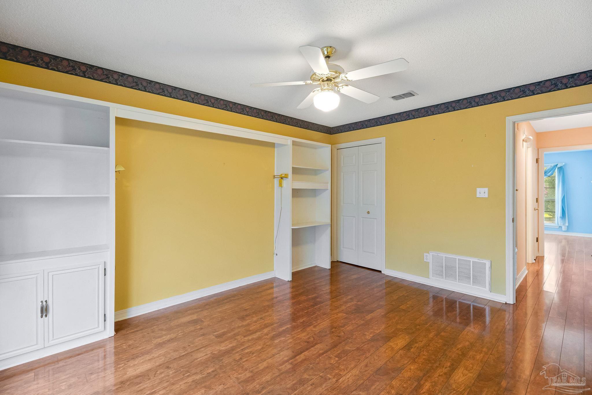 9320 Bell Ridge Drive Pensacola, FL 32526 - Photo 50 of 55 a view of empty room with wooden floor