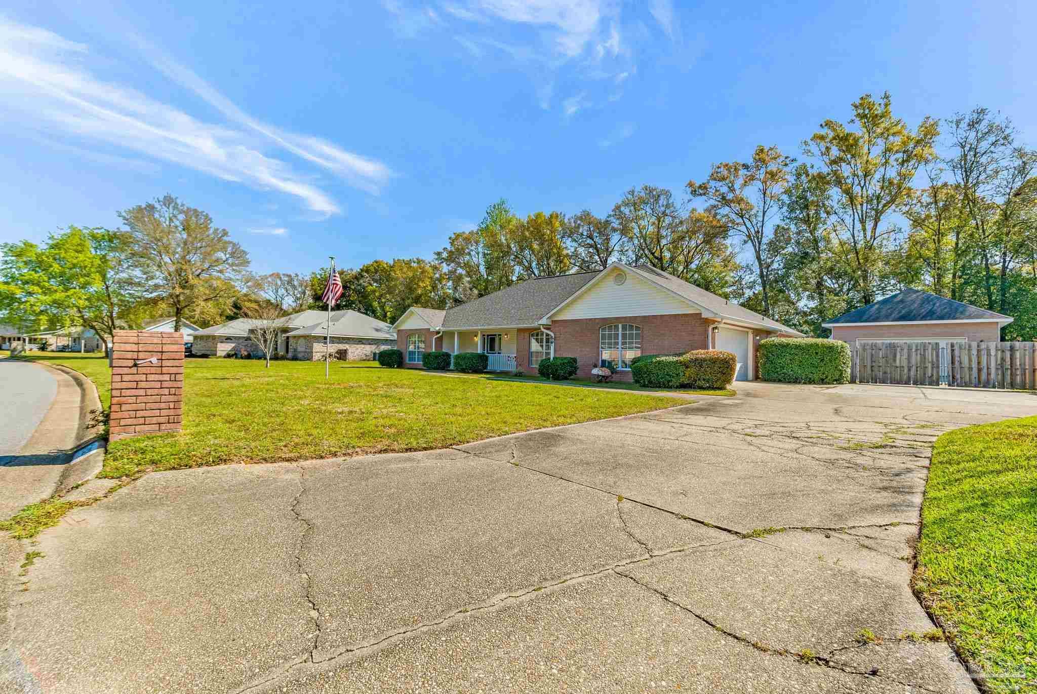 9320 Bell Ridge Drive Pensacola, FL 32526 - Photo 51 of 55 a view of a house with backyard and a tree