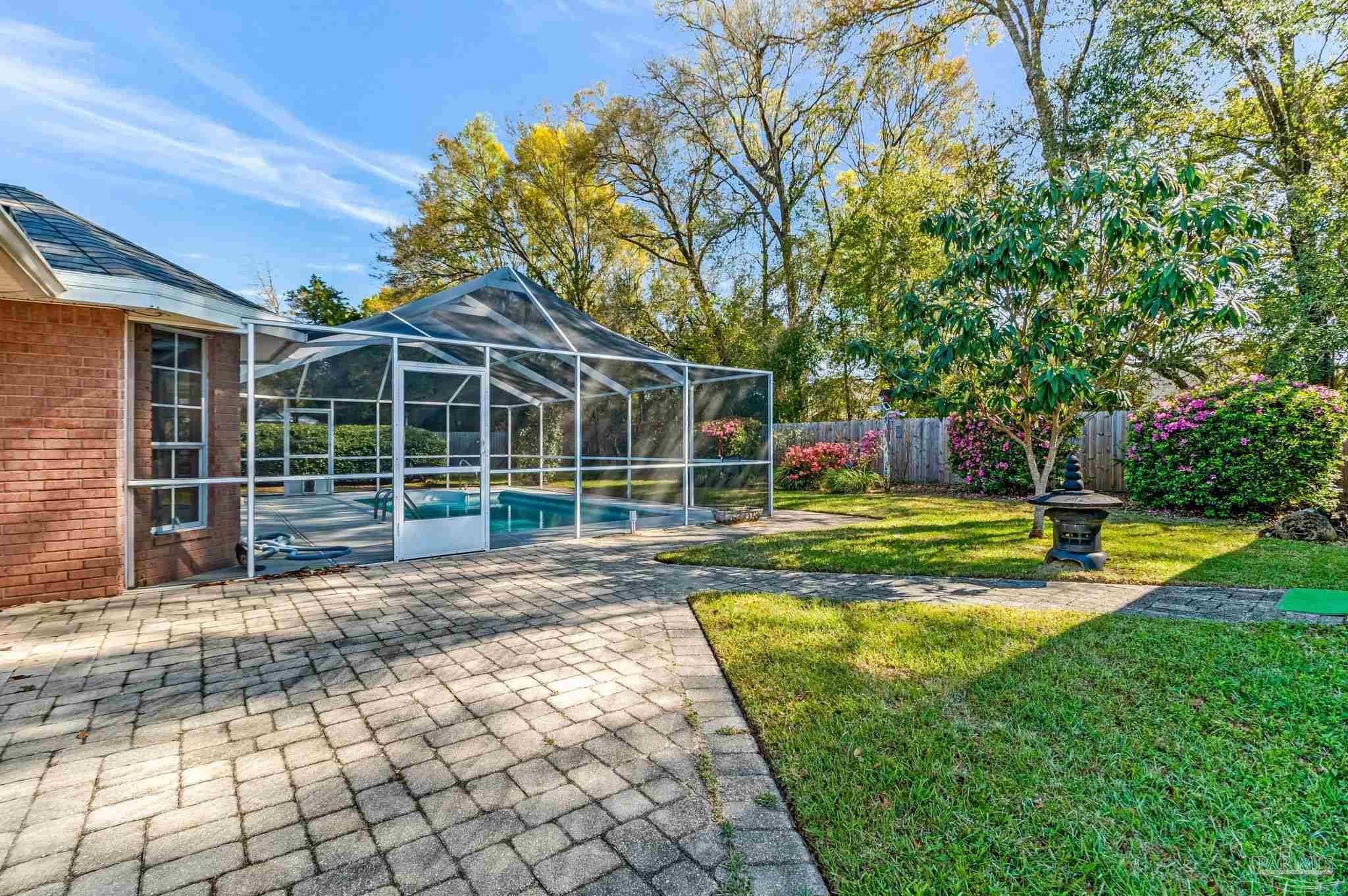 9320 Bell Ridge Drive Pensacola, FL 32526 - Photo 52 of 55 a view of a house with a yard