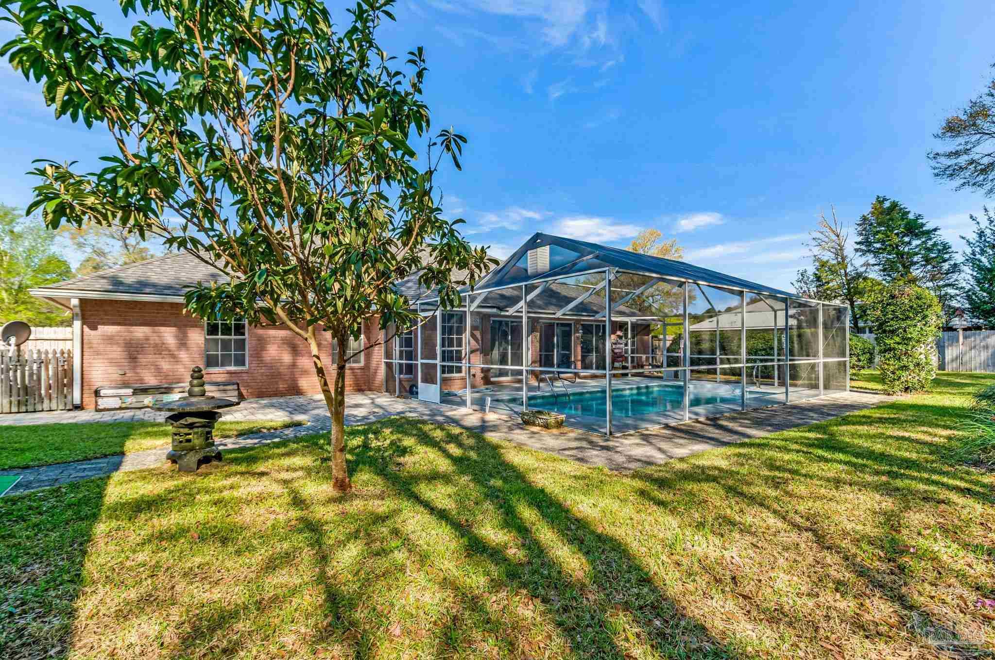 9320 Bell Ridge Drive Pensacola, FL 32526 - Photo 53 of 55 a view of a house with swimming pool and sitting area