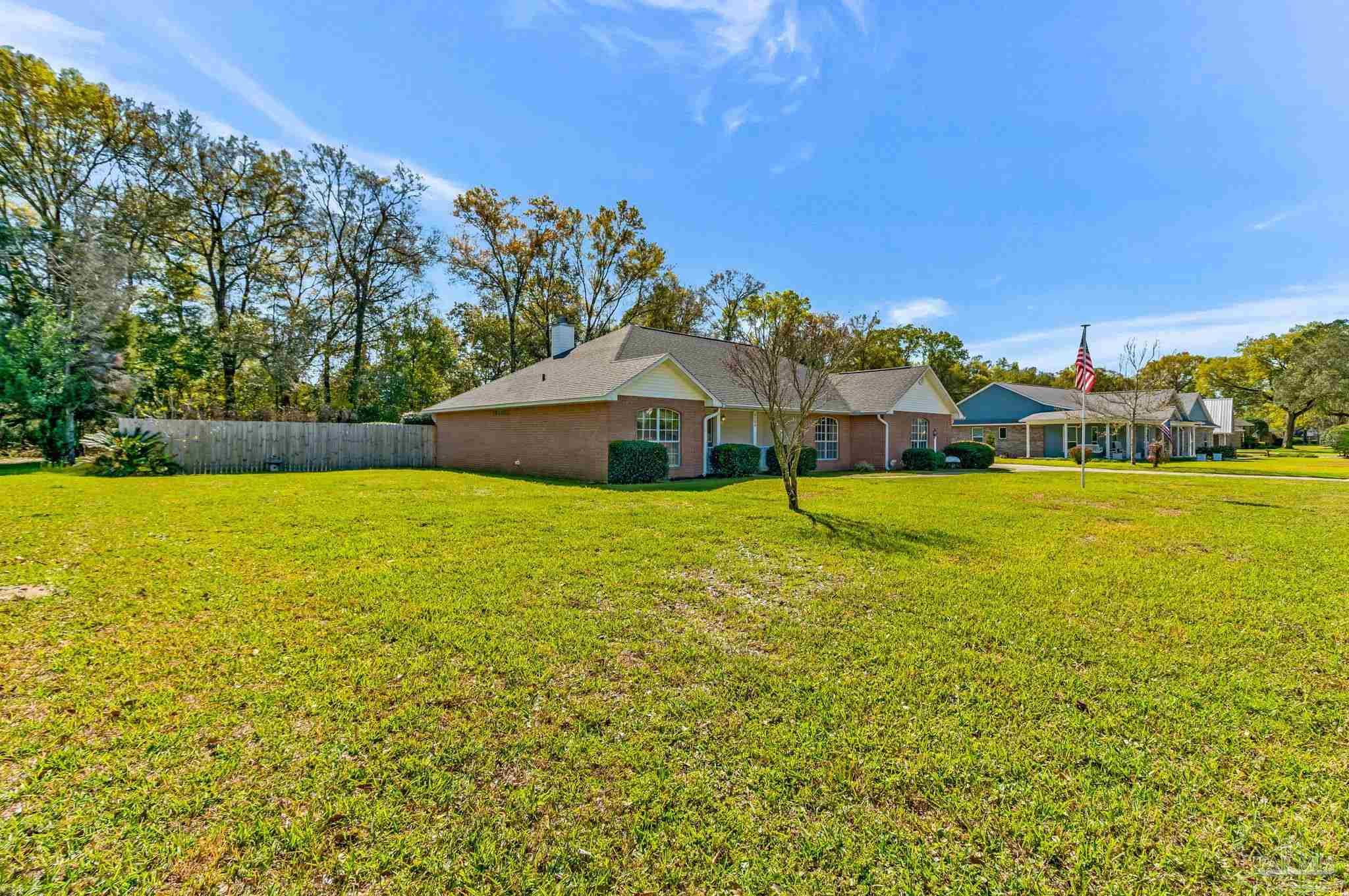 9320 Bell Ridge Drive Pensacola, FL 32526 - Photo 9 of 55 a view of a house with a big yard