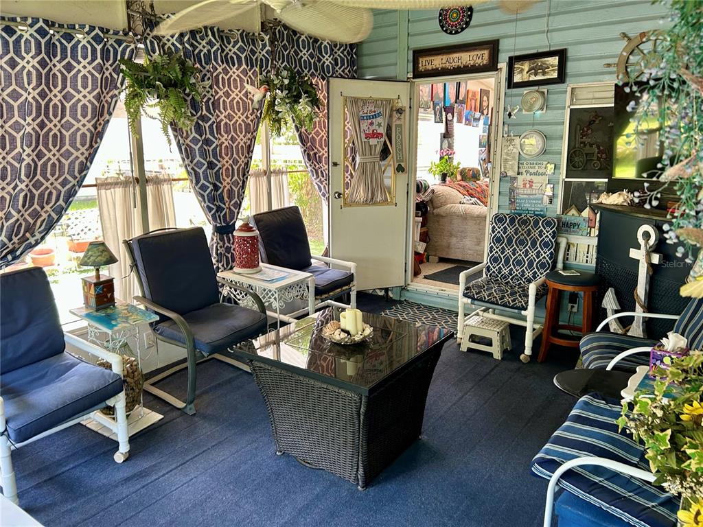 25646 Bass Road Astor, FL 32102 - Photo 30 of 48 a living room with furniture and wooden floor