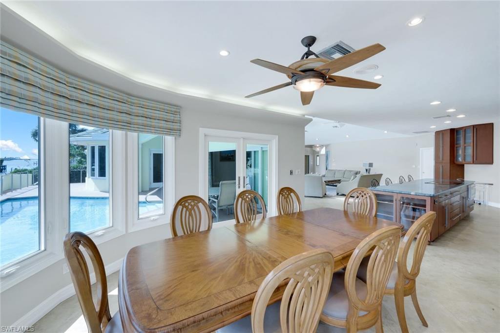 2147 Snook Drive Naples, FL 34102 - Photo 12 of 50 Dining area with recessed lighting, a ceiling fan, and french doors