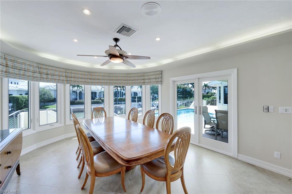 2147 Snook Drive Naples, FL 34102 - Photo 13 of 50 Dining space with ceiling fan, french doors, and recessed lighting