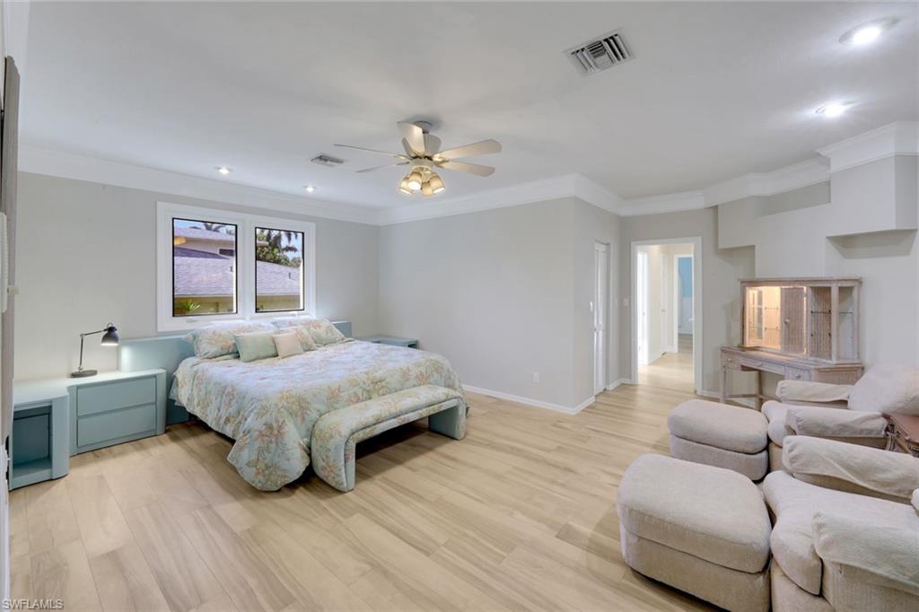 2147 Snook Drive Naples, FL 34102 - Photo 14 of 50 Bedroom featuring light wood-style floors, ornamental molding, ceiling fan, and recessed lighting