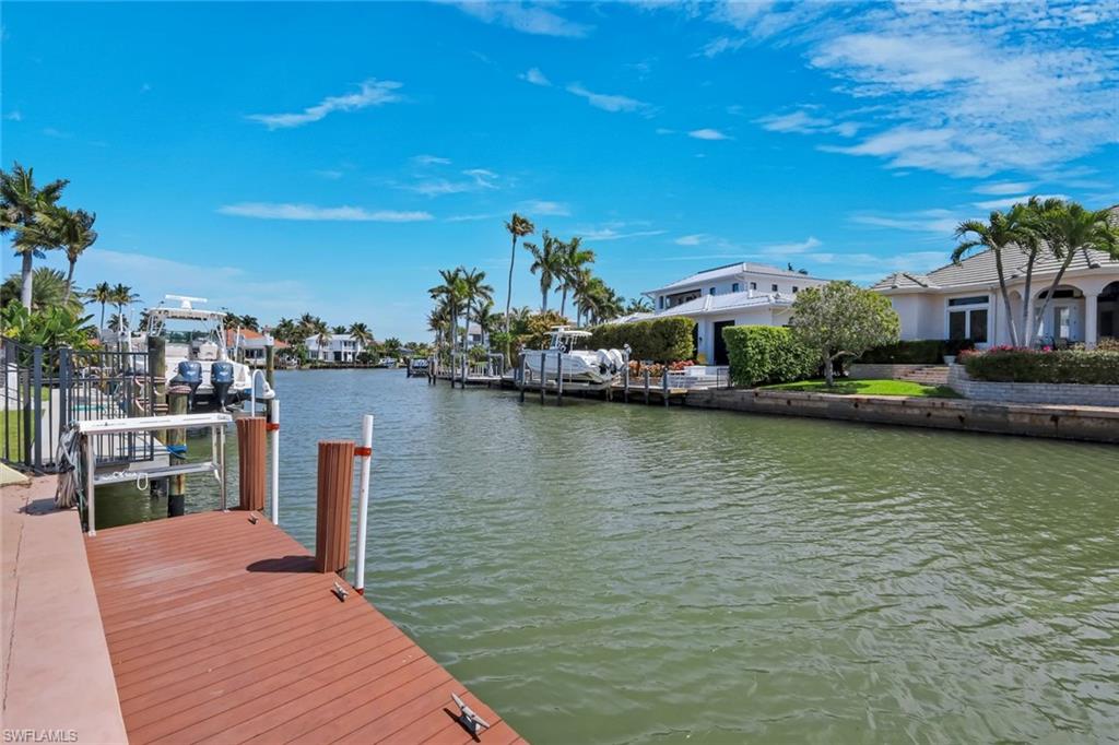 2147 Snook Drive Naples, FL 34102 - Photo 37 of 50 Dock with a water view
