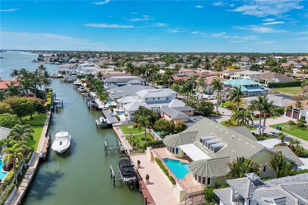 2147 Snook Drive Naples, FL 34102 - Photo 44 of 50 Aerial perspective of suburban area featuring a large body of water