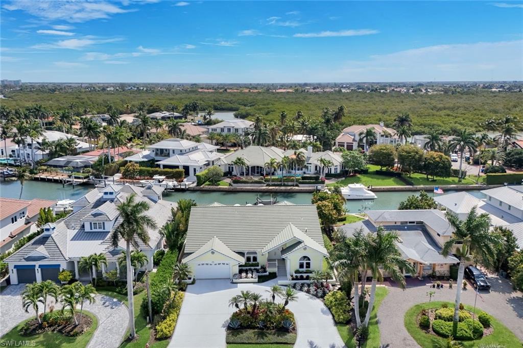 2147 Snook Drive Naples, FL 34102 - Photo 46 of 50 Aerial perspective of suburban area featuring a nearby body of water