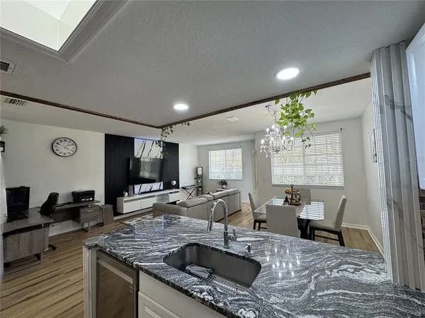 a kitchen with stainless steel appliances granite countertop a stove and refrigerator