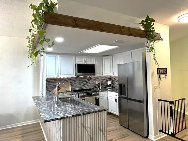 a bedroom with a bed and a television