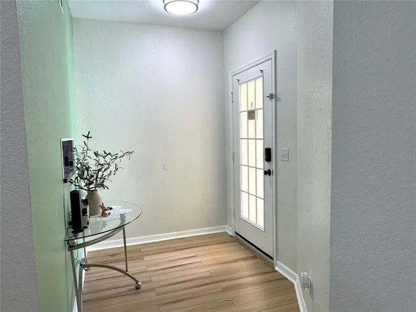 a view of entryway with wooden floor