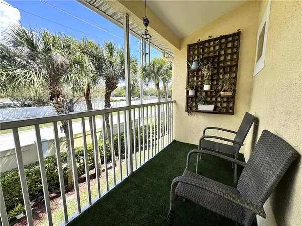 a large bed sitting in a bedroom next to a window