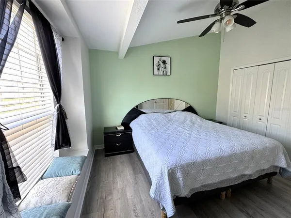 a swimming pool with outdoor seating and yard