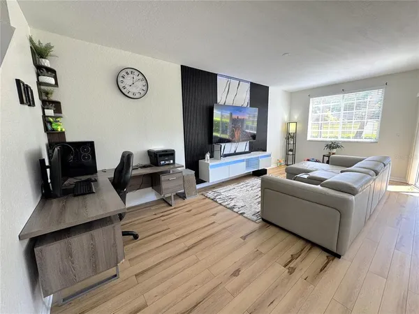 a kitchen with granite countertop a sink and a stove