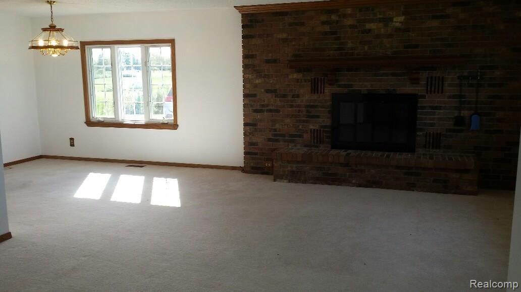 4700 Bricker Road Avoca, MI 48006 - Photo 2 of 16 Livingroom with built in fireplace
