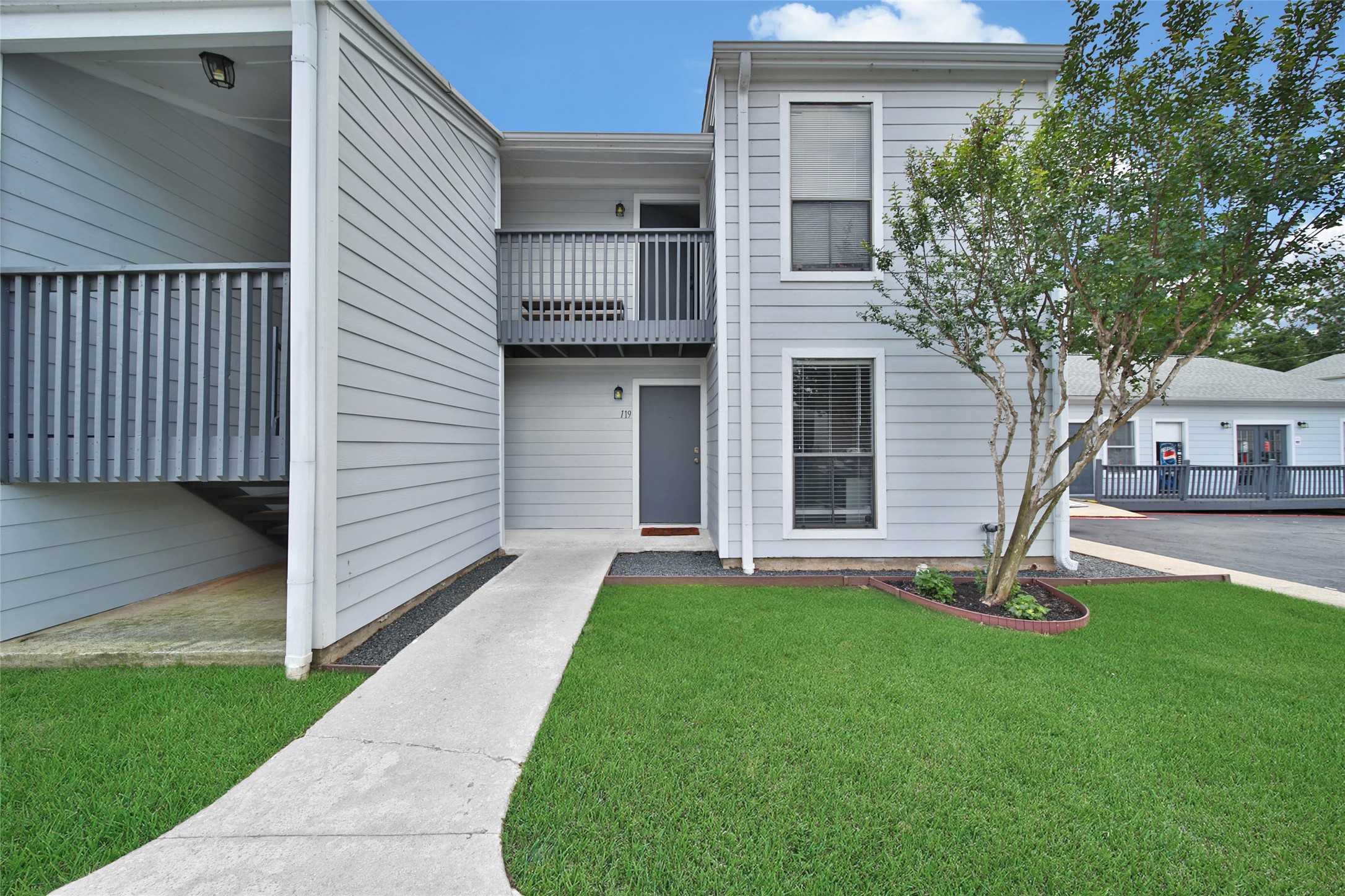 13151 Walden Road, Unit 119 Montgomery, TX 77356 - Photo 2 of 28 Location Location Location.... Corner Condo *check. Downstairs unit *check. Covered Back Patio *check. Lush grass and mature trees *check-check!