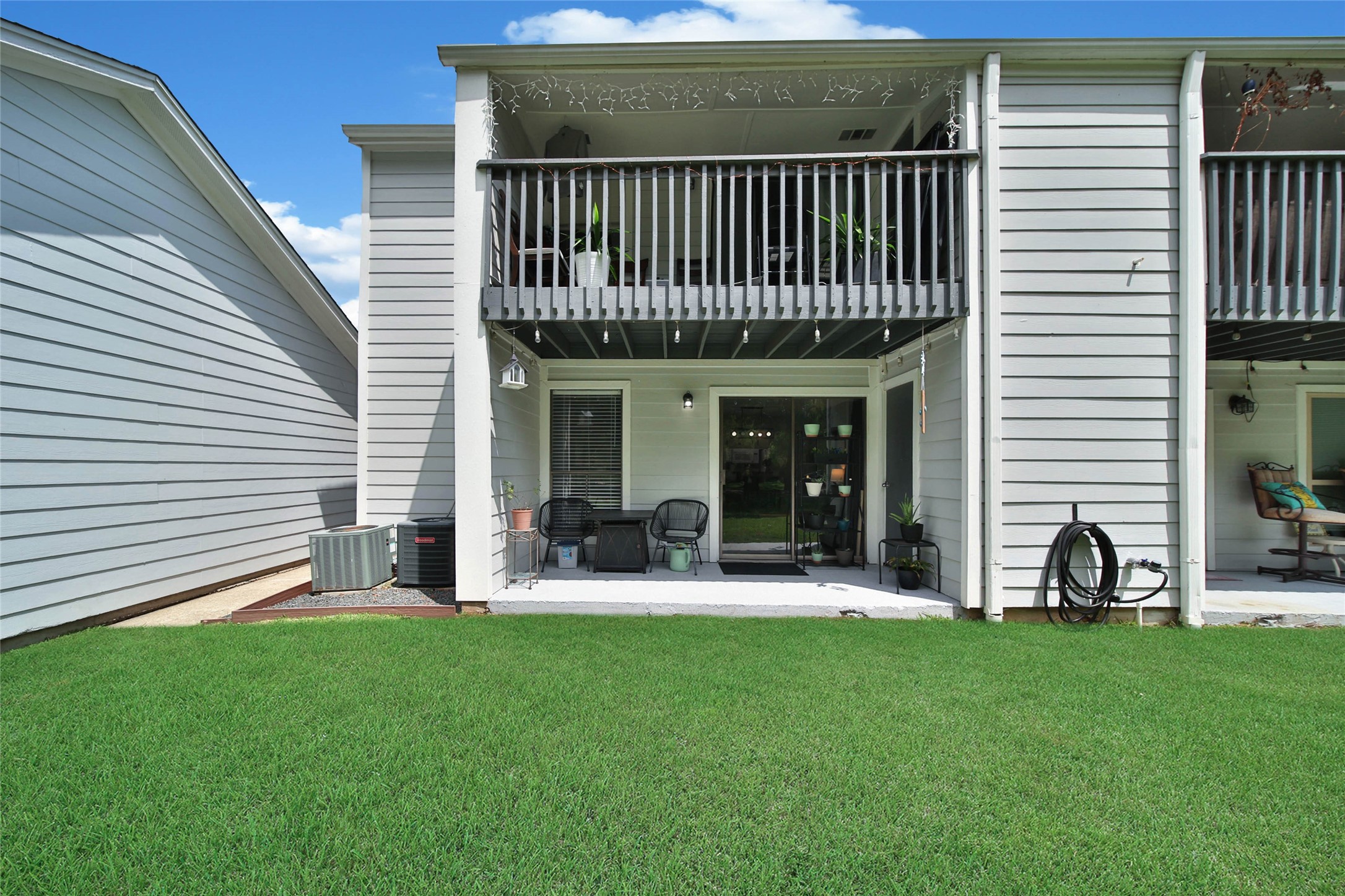 13151 Walden Road, Unit 119 Montgomery, TX 77356 - Photo 7 of 28 Directly off the family room is ample space for outdoor seating, perfect for relaxation and entertaining.