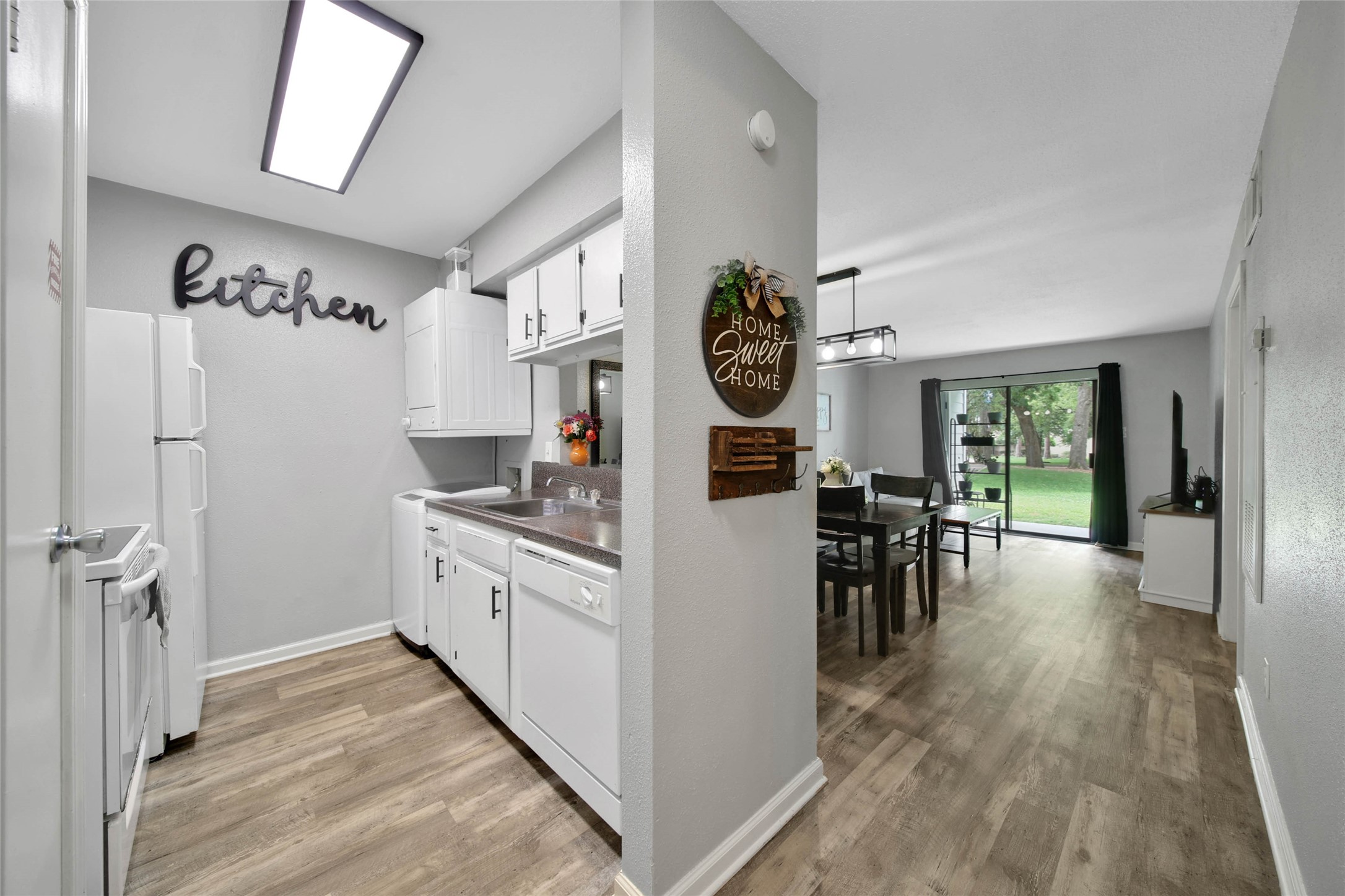 13151 Walden Road, Unit 119 Montgomery, TX 77356 - Photo 10 of 28 Come through the front door and pass by the kitchen, have a seat in the dining room or kick back in the living room!