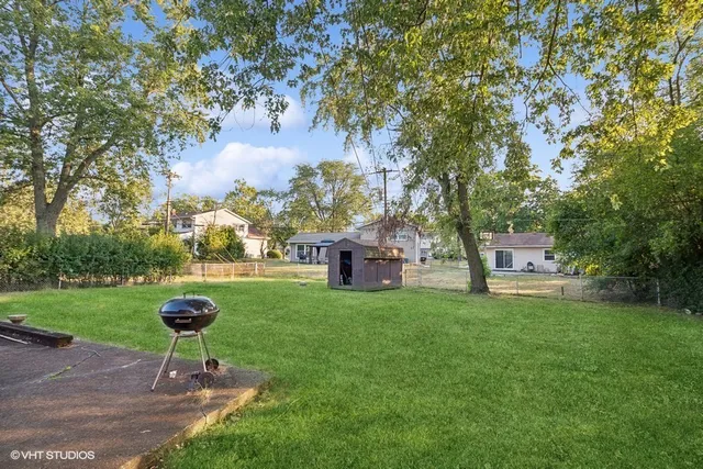 a swimming pool with outdoor seating and garden