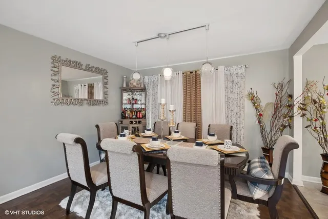 a dining room with furniture and window