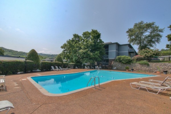 21 Vaughns Gap Road, Unit 143 Nashville, TN 37205 - Photo 6 of 6 a view of a swimming pool with an outdoor space and seating area