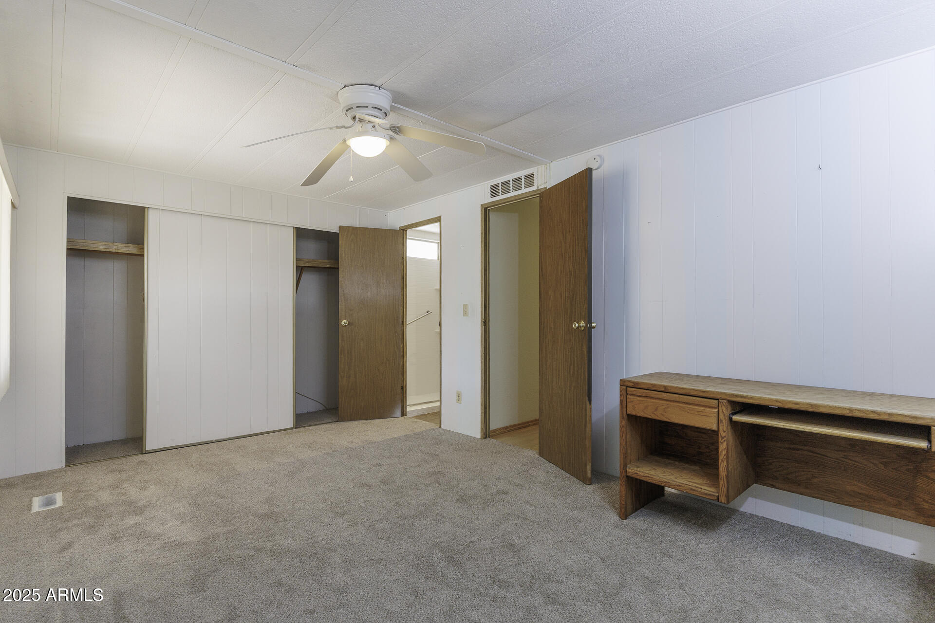 2100 North Trekell Road, Unit 20 Casa Grande, AZ 85122 - Photo 14 of 40 a view of an empty room with a fan