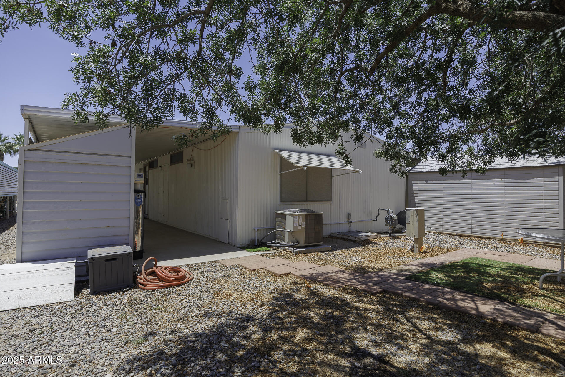 2100 North Trekell Road, Unit 20 Casa Grande, AZ 85122 - Photo 26 of 40 a view of a backyard with table and chairs