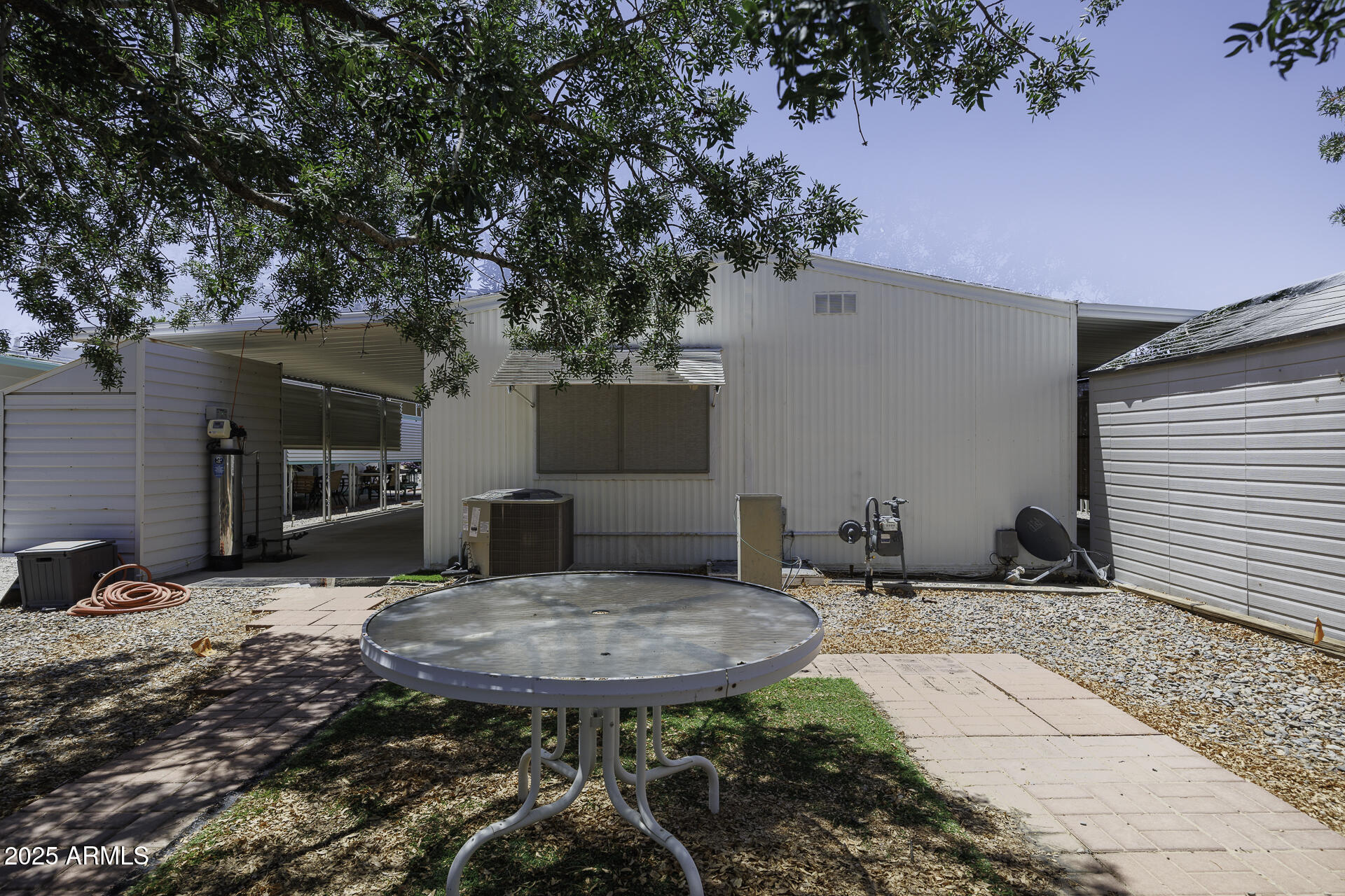 2100 North Trekell Road, Unit 20 Casa Grande, AZ 85122 - Photo 28 of 40 a view of a backyard with table and chairs