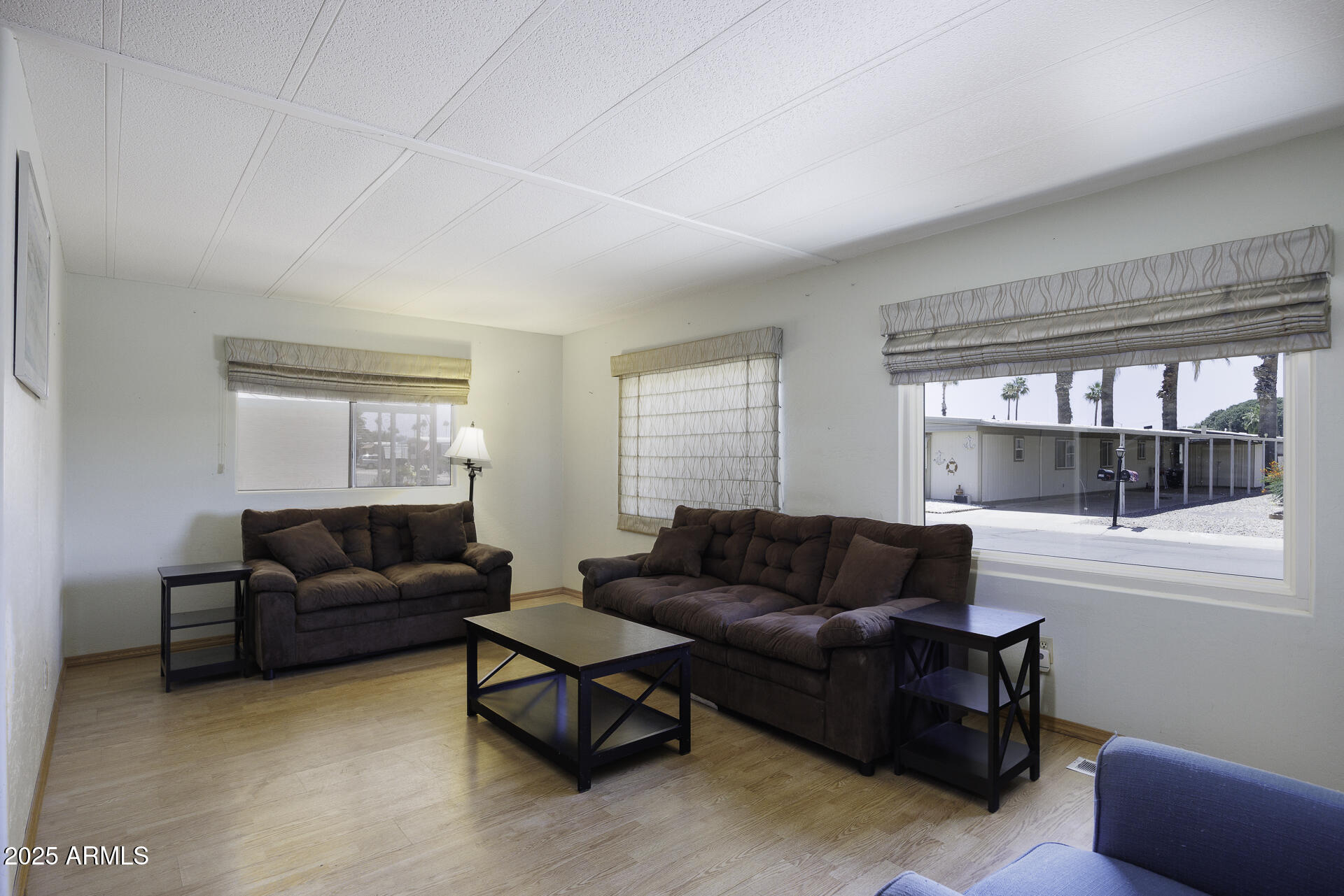 2100 North Trekell Road, Unit 20 Casa Grande, AZ 85122 - Photo 5 of 40 a living room with a couch and a window