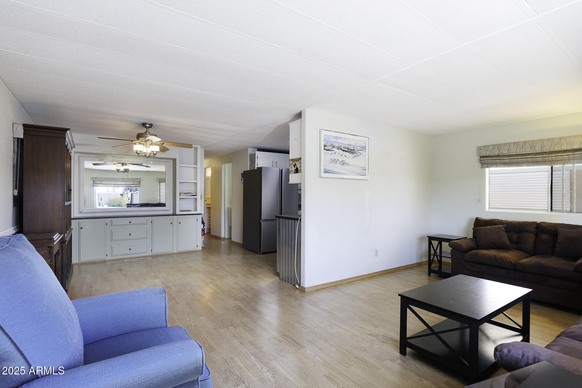 2100 North Trekell Road, Unit 20 Casa Grande, AZ 85122 - Photo 6 of 40 a living room with furniture and a wooden floor