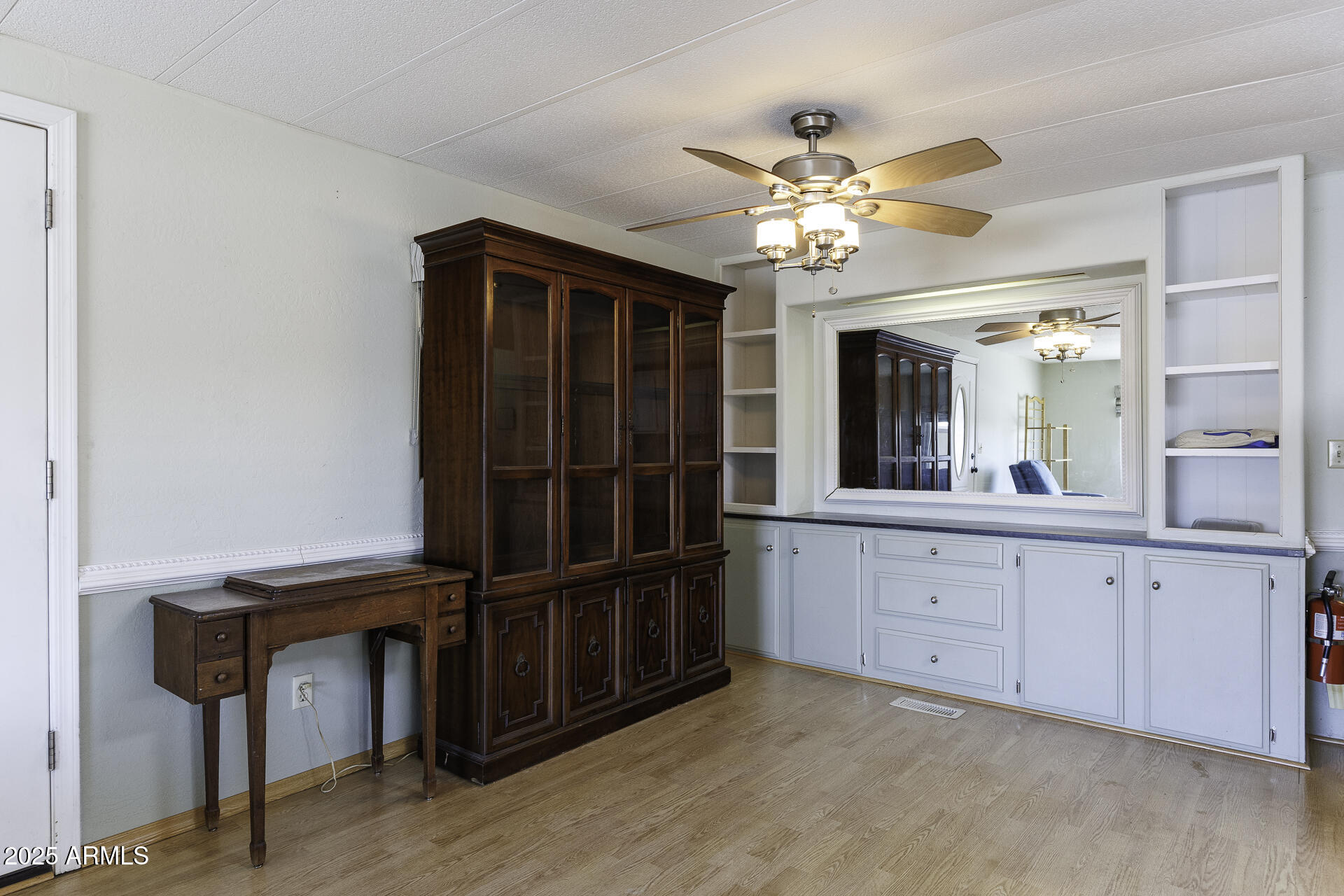 2100 North Trekell Road, Unit 20 Casa Grande, AZ 85122 - Photo 10 of 40 a view of a hallway with closet and a chandelier fan