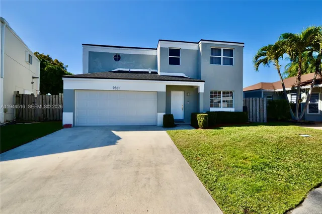a kitchen with a sink and a stove top oven
