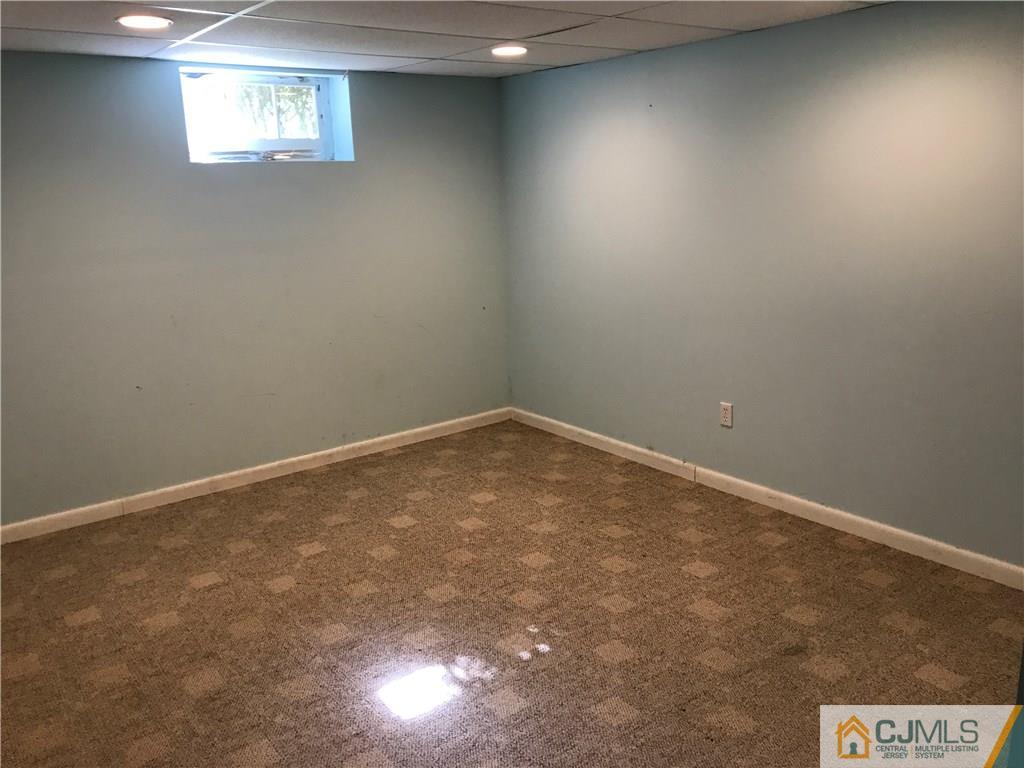 26 Francis Road East Brunswick, NJ 08816 - Photo 18 of 23 en empty room with windows