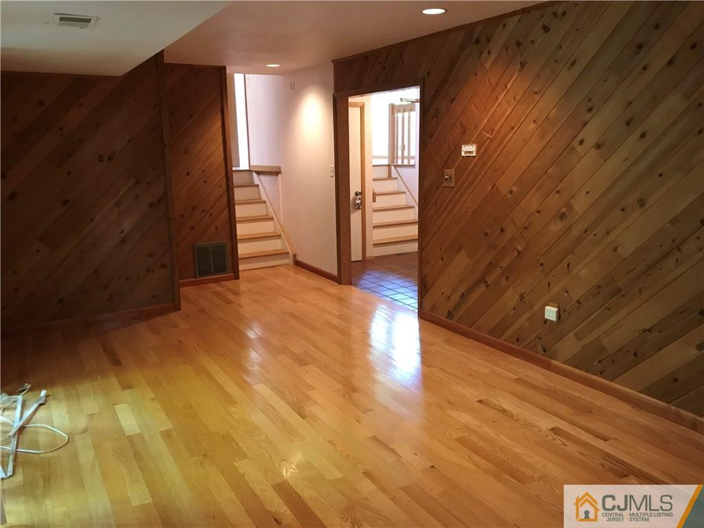 26 Francis Road East Brunswick, NJ 08816 - Photo 4 of 23 a view of a hallway with wooden floor